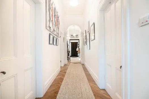 Bright modern hallway in Melbourne home with contemporary artwork and stylish interior design.